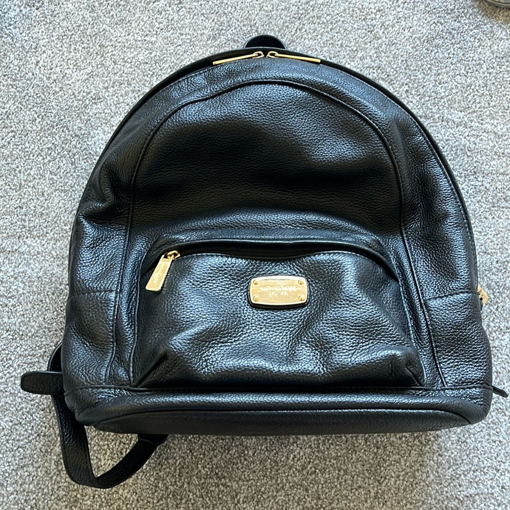 Micheal kors black and gold leather backpack